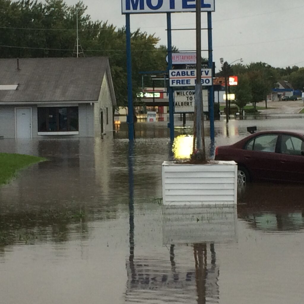 flooding showing a motel surrounded by water in Albert Lea